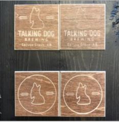 Product Image: Square, wooden coasters with talking dog brewing logo